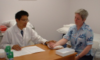 Dr. Joe Wang with patient